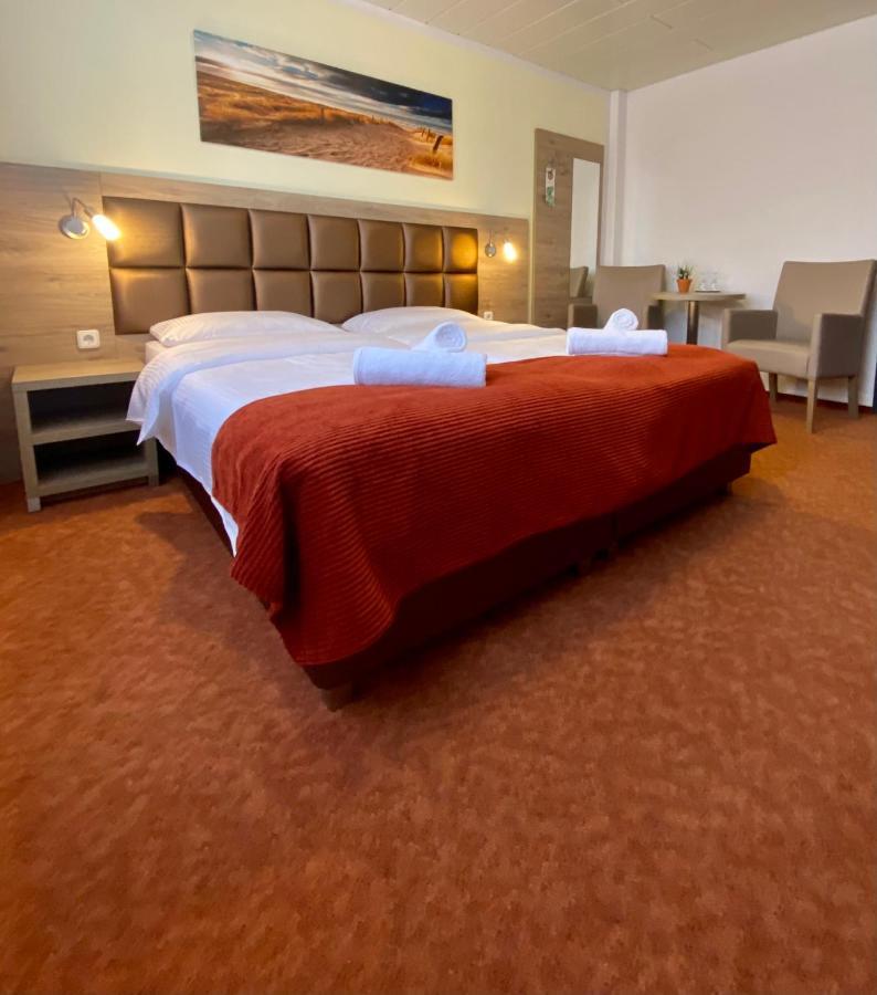 Strand Hotel Nordsee, Hotel Deichlaeufer Tossens Esterno foto